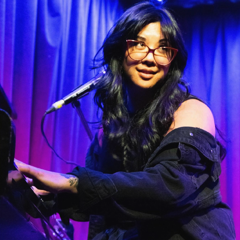Melissa Alcazar performing on stage